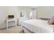 Bedroom featuring a large bed, white dresser and entry to hallway at 836 Palmetto Tyrone Rd, Sharpsburg, GA 30277