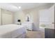 Bedroom with a large bed, white dresser and entry to hallway at 836 Palmetto Tyrone Rd, Sharpsburg, GA 30277