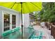 Outdoor deck features dining area, outdoor furniture and overlooks lush backyard at 836 Palmetto Tyrone Rd, Sharpsburg, GA 30277