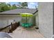 Spacious outdoor deck with dining table, chairs, and umbrella, ideal for entertaining at 836 Palmetto Tyrone Rd, Sharpsburg, GA 30277