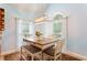 Charming dining area with natural light, comfortable seating, and stylish decor at 836 Palmetto Tyrone Rd, Sharpsburg, GA 30277