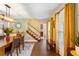 Elegant dining room showcasing a beautiful dining table, complemented by hardwood floors and natural light at 836 Palmetto Tyrone Rd, Sharpsburg, GA 30277