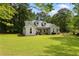 Lovely single-story home with a manicured lawn and mature trees, creating a peaceful and inviting atmosphere at 836 Palmetto Tyrone Rd, Sharpsburg, GA 30277