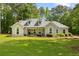 Attractive single-story home with manicured landscaping and a spacious front yard, offering a welcoming ambiance at 836 Palmetto Tyrone Rd, Sharpsburg, GA 30277
