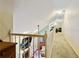 Bright hallway with railing overlooking living space at 836 Palmetto Tyrone Rd, Sharpsburg, GA 30277