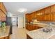 Large kitchen featuring granite countertops, custom cabinets, and stainless appliances at 836 Palmetto Tyrone Rd, Sharpsburg, GA 30277