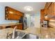 Updated kitchen with stainless steel appliances and expansive granite countertops at 836 Palmetto Tyrone Rd, Sharpsburg, GA 30277