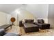 Cozy living room features a comfortable couch and a stylish patterned rug at 836 Palmetto Tyrone Rd, Sharpsburg, GA 30277