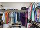 Organized walk-in closet providing ample storage with shelves and hanging rods at 836 Palmetto Tyrone Rd, Sharpsburg, GA 30277