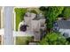 Aerial view of a home with a well-maintained roof, driveway, manicured lawn, and mature trees at 1849 Rock Springs Ne Ln, Atlanta, GA 30324