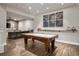 Finished basement with a pool table, dark wood floors, and comfortable seating area at 1849 Rock Springs Ne Ln, Atlanta, GA 30324