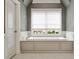 Luxurious soaking tub with tile surround and window offering a private view at 1849 Rock Springs Ne Ln, Atlanta, GA 30324