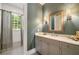 Bathroom featuring marble vanity, neutral paint, and shower-tub combo at 1849 Rock Springs Ne Ln, Atlanta, GA 30324
