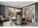 Dining room featuring chandelier, large windows, and sophisticated decor at 1849 Rock Springs Ne Ln, Atlanta, GA 30324