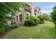 Brick home exterior featuring a well-maintained lawn, mature trees, and an outdoor grill on the patio at 1849 Rock Springs Ne Ln, Atlanta, GA 30324