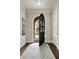 Elegant foyer with arched doorway, hardwood floors and stylish area rug at 1849 Rock Springs Ne Ln, Atlanta, GA 30324