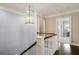 Hallway with a view down a staircase with a light fixture and white trim at 1849 Rock Springs Ne Ln, Atlanta, GA 30324