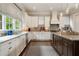 Bright kitchen with stainless steel appliances, white cabinets, and granite countertops at 1849 Rock Springs Ne Ln, Atlanta, GA 30324
