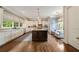 Bright kitchen featuring a large center island, white cabinets, stainless steel appliances, and hardwood floors at 1849 Rock Springs Ne Ln, Atlanta, GA 30324