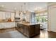 Modern kitchen featuring a center island with granite countertop and stainless steel microwave at 1849 Rock Springs Ne Ln, Atlanta, GA 30324