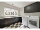 Laundry room with washer, dryer, dark wood cabinets, and a granite countertop at 1849 Rock Springs Ne Ln, Atlanta, GA 30324