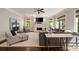 Spacious living room with a fireplace, neutral color palette, and a ceiling fan at 1849 Rock Springs Ne Ln, Atlanta, GA 30324