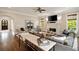 Spacious living room with hardwood floors, fireplace, sofa, and elegant decor with ceiling fan at 1849 Rock Springs Ne Ln, Atlanta, GA 30324