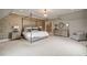 Bedroom with neutral colors, large carpeted floor, bed, and side tables at 1849 Rock Springs Ne Ln, Atlanta, GA 30324
