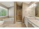 Bathroom boasts a luxurious soaking tub, walk-in shower, and granite countertops at 2154 Marne Nw Gln, Kennesaw, GA 30152