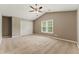 Bright bedroom featuring vaulted ceilings, carpet floors, a ceiling fan and ample natural light at 2154 Marne Nw Gln, Kennesaw, GA 30152