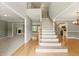 Elegant foyer features hardwood floors, a staircase with iron spindles, and neutral paint at 2154 Marne Nw Gln, Kennesaw, GA 30152