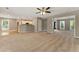 Open concept living room with neutral tones and a partial view of the kitchen at 2154 Marne Nw Gln, Kennesaw, GA 30152