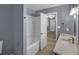 Bright bathroom showcasing a tub, modern fixtures, and stylish flooring at 2401 Phillips Rd, Lithonia, GA 30058