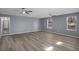 Large living room with ample space, stylish floors, and natural light from windows at 2401 Phillips Rd, Lithonia, GA 30058