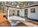 Outdoor patio area featuring white slat privacy screen and access to the home at 2401 Phillips Rd, Lithonia, GA 30058