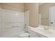 A simple bathroom features a shower and vanity with a large mirror at 2455 Ivey Oaks Rd, Cumming, GA 30041