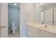 Bathroom featuring white vanity, tiled floors, and a separate room with a toilet and shower at 2455 Ivey Oaks Rd, Cumming, GA 30041