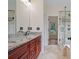 An en suite bathroom features double vanity, and glass enclosed shower at 2455 Ivey Oaks Rd, Cumming, GA 30041