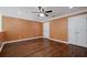 Spacious bedroom featuring hardwood floors, crown molding, and a double door closet at 2455 Ivey Oaks Rd, Cumming, GA 30041