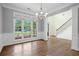 Spacious dining room featuring a chandelier and beautiful windows offering natural light and neighborhood views at 2455 Ivey Oaks Rd, Cumming, GA 30041