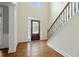 Elegant foyer with hardwood floors, decorative door, and staircase at 2455 Ivey Oaks Rd, Cumming, GA 30041