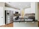 Well-appointed kitchen with granite countertops, stainless steel appliances, and white cabinetry at 2455 Ivey Oaks Rd, Cumming, GA 30041