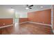 Spacious loft with hardwood floors, wainscoting, and an open view to the main level at 2455 Ivey Oaks Rd, Cumming, GA 30041