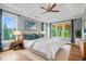 Serene main bedroom featuring tray ceilings, natural light, and a relaxing atmosphere at 2455 Ivey Oaks Rd, Cumming, GA 30041
