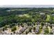 Neighborhood aerial view showcasing homes within a community surrounded by mature trees at 556 Poplar Bnd, Canton, GA 30114