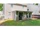 View of the backyard and a partially covered patio at 556 Poplar Bnd, Canton, GA 30114