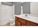 Bathroom with vanity, tiled floor, shower, and updated hardware at 556 Poplar Bnd, Canton, GA 30114