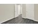 Bedroom featuring gray wood-look flooring and a white door at 556 Poplar Bnd, Canton, GA 30114