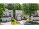 Neighborhood view of cozy two-story home with single-car garage and driveway in a well-maintained community at 556 Poplar Bnd, Canton, GA 30114