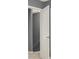 A hallway with neutral gray walls and bright white doors at 556 Poplar Bnd, Canton, GA 30114
